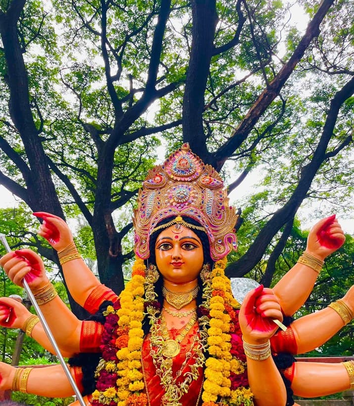 The Durga idol at an Assam Association Bangalore Puja, garlanded with marigold